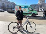 San Francisco resident Daniel Leong poses with a bike be brought to a San Francisco Public Library repair day.