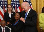 President Biden presents gymnast Simone Biles with the Presidential Medal of Freedom, the nation's highest civilian honor, on July 7 at the White House.