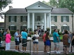 Visitors line up to enter the Graceland mansion in 2017, 40 years after Elvis' death.