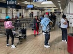 People gather at the Greyhound bus station in Richmond.