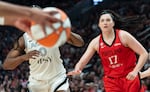 FILE - Las Vegas Aces guard Jackie Young (0) looks for a pass as Portland Fire center Megan DiLeo (17) rushes in to block at the Moda Center in Portland, Ore., on July 9, 2026.