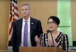 In this video screenshot, Portland Mayor Ted Wheeler, left, and Multnomah County Chair Jessica Vega Pederson present their proposed framework for extending the partnership between the city and the county in the Joint Office of Homeless Services through June 2027. The press conference was held Dec. 6, 2023 at the Multnomah County Commissioners Board Room.