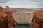 Glen Canyon Dam holds back Lake Powell near Page, Ariz. Water levels behind the dam have dropped so low that invasive smallmouth bass are able to swim downstream, and now threaten native fish in the Grand Canyon.