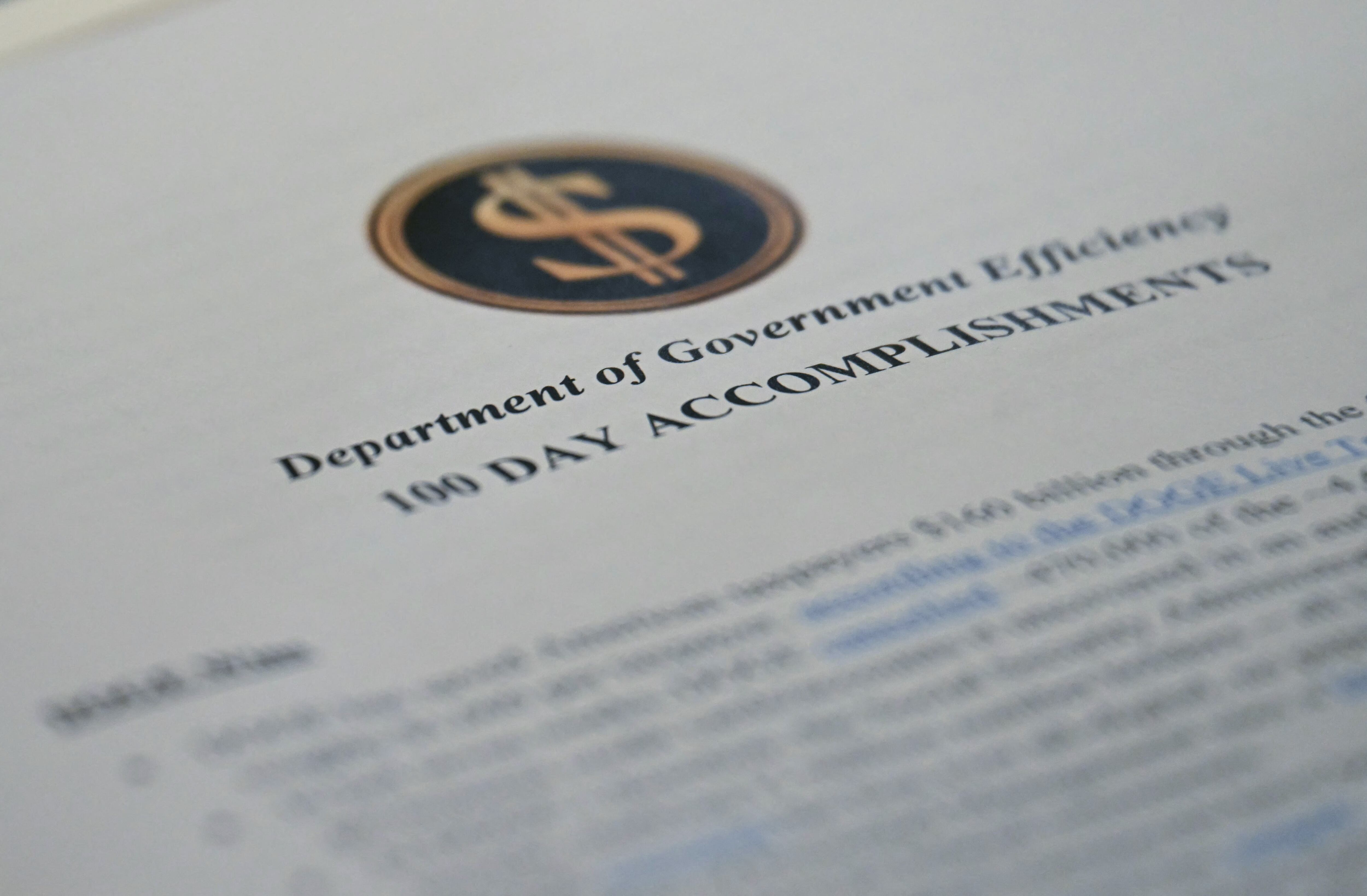 A report on cost cuts made by what's known as the Department of Government Efficiency on the Cabinet Room table at the White House on April 30, 2025.