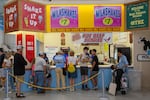 A food counter menu lists various milkshakes and a Hot Beef Sundae for sale at the New York State Fair in Syracuse, New York, on Friday, August 30, 2024.