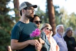 Craig Van Bruggen and Charlene Chew attend a community vigil Monday, Aug. 29, 2022, following an attack on a Bend shopping center. Van Bruggen was in the Safeway grocery during the shooting and credits store employee Donald Surrett with saving lives.