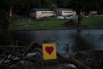 A broken heart sign is displayed near Camp Mystic on July 8 after a flash flood swept through the area in Hunt, Texas.