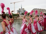 Actors perform during the opening ceremony of the 2024 Summer Olympics, Friday, July 26.