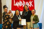 Future Generations Collaborative members hold a freshly signed ownership agreement for the former Presbyterian Church of Laurelhurst on March 15, 2024. Left to right: Jennifer Pertile, her five-month-old son Gray, Jillene Joseph, Natalyn Begay and Chenoa Landry.