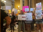 Abortion-rights protesters fill Indiana Statehouse corridors and cheer outside legislative chambers, Friday, Aug. 5, 2022, as lawmakers vote to concur on a near-total abortion ban, in Indianapolis.