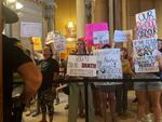 Abortion-rights protesters fill Indiana Statehouse corridors and cheer outside legislative chambers, Friday, Aug. 5, 2022, as lawmakers vote to concur on a near-total abortion ban, in Indianapolis.