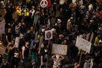 A subsection of the crowd marches toward the Marriott hotel in downtown Portland, Ore., July 25, 2020. Portland has sustained protests against police brutality and systemic racism for 58 days.