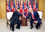 A handout photo provided by Dong-A Ilbo of North Korean leader Kim Jong Un and U.S. President Donald Trump attend a meeting on the south side of the demilitarized zone (DMZ) separating the South and North Korea on June 30, 2019 in Panmunjom, South Korea.