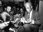 James Baldwin signing books in a crowded book store, 1980. (Photo by Afro American Newspapers/Gado/Getty Images)