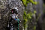 A small bronze statue of Steve Prefontaine affixed to Pre's Rock in Eugene, Ore., as seen on Saturday, Jan. 19, 2019.