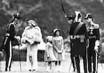 July 5, 1937: Lord Elphinstone (left) greets the British Royal Family. From left: Queen Elizabeth the Queen Mother (second from left), Princess Margaret (third from left), Princess Elizabeth (third from right) and King George VI (far right) at Holyrood Palace, Edinburgh, Scotland.