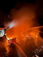 Firefighters attack a fire Wednesday morning, June 7, 2023, at an industrial complex in Salmon Creek in Vancouver, Washington. At least seven buildings were destroyed but no injuries were reported.