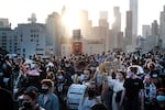 Black Lives Matter supporters and others march across the Brooklyn Bridge to honor George Floyd on the one year anniversary of his death on May 25, 2021 in New York City.