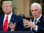 FILE - President Donald Trump listens as Vice President Mike Pence speaks about the coronavirus in the Rose Garden of the White House, April 27, 2020, in Washington.