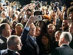 President Biden takes a selfie with supporters during a rally in New York ahead of the 2022 midterm elections.