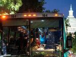 Migrants from Venezuela, who boarded a bus in Del Rio, Texas, disembark within view of the US Capitol in Washington, D.C., on August 2.