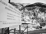 Sign at the upper reservoir construction area gives details of Public Service Company's Cabin Creek Pumped Storage project, a hydroelectric power installation at an elevation above 10,000 feet near Georgetown, Colorado on April 22, 1965.