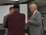 Oregon U.S. Rep. Cliff Bentz, right, talks to a voter at a town hall in Jackson County, Ore., on Aug. 22, 2023.