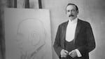 Homer Davenport, cartoonist from Silverton, Oregon, standing next to his work during one of his "chalk talks."