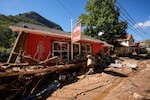 Businesses are seen in a debris field in the aftermath of Hurricane Helene, Wednesday, Oct. 2, 2024, in Chimney Rock Village, N.C.