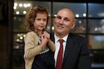 Camille Vlietstra, 4, with her uncle Will Lathrop, at his election night party held at Rossi Farms in Portland, Ore., Nov. 5, 2024.