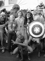 First lady Rosalynn Carter and daughter Amy are surrounded by comic book characters gathered at the White House in October 1980 to support President Jimmy Carter's program for energy efficiency.