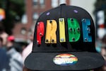 A volunteer wore a hat embroidered with the word PRIDE. Tens of thousands of people took the opportunity to celebrate the city's LGBTQ community Sunday, June 19, 2016, as part of Portland's annual Pride Week parade.