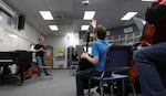 Zachary Banks, left, is the string instructor for the Oregon East Symphony's Playing for Keeps string education program.