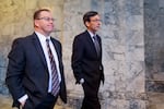 Superintendent of Public Instruction Chris Reykdal, left, walks with Attorney General Bob Ferguson, right, before the State of the State address from Gov. Jay Inslee during a joint legislative session at the Washington state Capitol, Tuesday, Jan. 9, 2024, in Olympia, Wash.