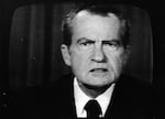 Richard Nixon is shown on a television screen.