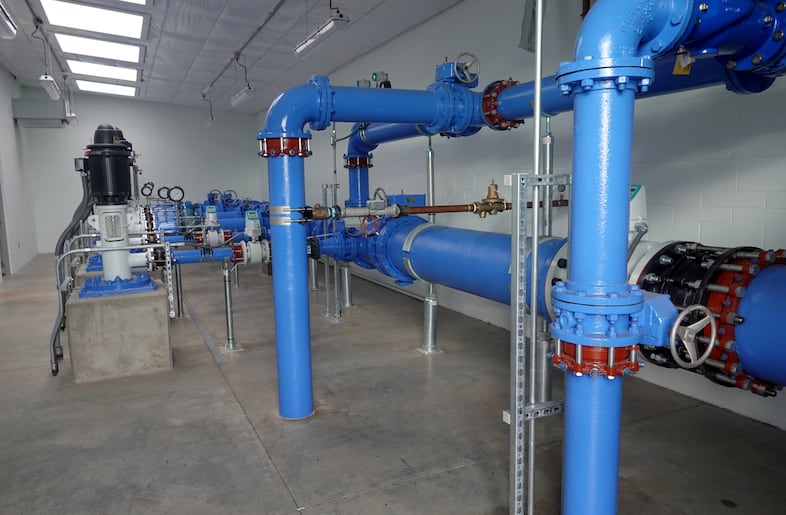 Pumps power a well, piping groundwater into a 3.5 million gallon reservoir on the west side of Redmond, Feb 1, 2024.
