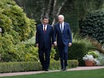 U.S. President Joe Biden (R) and Chinese President Xi Jinping walk together after a meeting in California last November. White House officials say the meeting led to better cooperation on fentanyl interdiction, but some experts are skeptical.