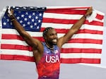 American sprinter Noah Lyles celebrates after winning the gold medal in in the men's 100-meters final at the Paris Olympics on Sunday in Saint-Denis, France.