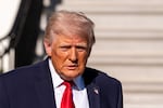 President Trump speaks with reporters before departing on Marine One from the South Lawn of the White House on April 11 in Washington.
