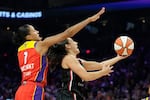 Portland Fire guard Carla Leite, right, drives past Phoenix Mercury forward Noemie Brochant (1) during the first half of a WNBA basketball game Sunday, Aug. 16, 2026, in Phoenix.