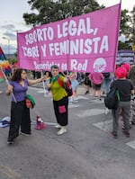 Ruth Zurbriggen (center) speaks to another participant at a march during the Encuentro. She is one of the founders of Socorristas en Red (First Responders Network), which is now the biggest abortion accompaniment network in the world.