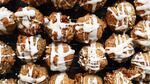 Ball-shaped cookies with frosting.