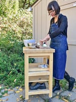 The Marshalls' Southeast Portland live-work set-up is versatile; out in back, family shoes hitch a ride on a rolling butcher block's shelves. 