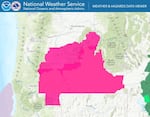 A map of Oregon with a pink overlay indicating of of the eastern part of the state is under red flag warning