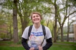 Spence Garfield, a student at Portland State University, poses for a portrait on an empty South Park Blocks in downtown Portland, Ore., on Tuesday, April 21, 2020. Colleges across Oregon have shifted to online-only courses in the face of the coronavirus pandemic.