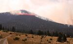 Air tankers make drops in attempt to slow and control the Canyon Creek Complex. About 300 firefighters are in the area to control the fast-moving fire.