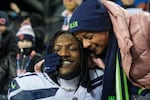 Seattle Seahawks cornerback Riq Woolen, left, shares a moment with his mother following an NFL football game against the Chicago Bears, Thursday, Dec. 26, 2024, in Chicago. The Seahawks won 6-3.