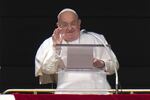 Pope Francis delivers his blessing as he recites the Angelus noon prayer from the window of his studio overlooking St. Peter's Square, at the Vatican, Sunday, Feb. 2, 2025.
