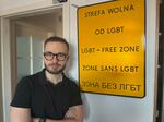 Civil rights activist Bart Staszewski stands beside a sign he made as a performance art project to raise awareness about the dozens of cities in eastern Poland that had declared themselves "LGBT-free zones." Staszewski streamed video of himself holding the official-looking sign in each of the cities, an effort that brought international awareness to the issue.