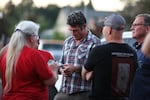 Republican challenger Joe Kent checks his phone on Aug. 2 as results of Washington's 3rd Congressional District primary begin to roll in. Kent earned former President Donald Trump's endorsement in the race.